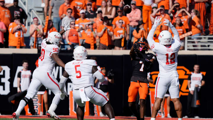 Oklahoma State Cowboys wide receiver Shamar Rigby (7) throws a touchdown pass during a college football game between the Oklahoma State Cowboys (OSU) and the Houston Cougars at Boone Pickens Stadium in Stillwater, Okla., Saturday, Oct. 11, 2025. Oklahoma State Cowboys wide receiver Shamar Rigby (7) throws a touchdown pass during a college football game between the Oklahoma State Cowboys (OSU) and the Houston Cougars at Boone Pickens Stadium in Stillwater, Okla., Saturday, Oct. 11, 2025.