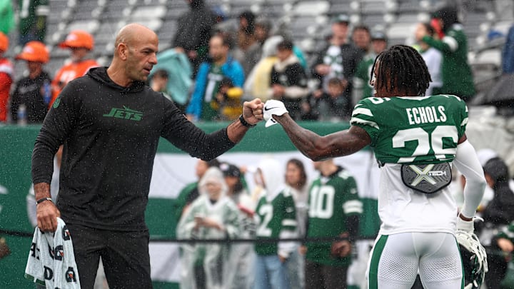 Sep 29, 2024; East Rutherford, New Jersey, USA; New York Jets head coach Robert Saleh fist pumps cornerback Brandin Echols (26) before the game against the Denver Broncos at MetLife Stadium. Mandatory Credit: Vincent Carchietta-Imagn Images Sep 29, 2024; East Rutherford, New Jersey, USA; New York Jets head coach Robert Saleh fist pumps cornerback Brandin Echols (26) before the game against the Denver Broncos at MetLife Stadium. Mandatory Credit: Vincent Carchietta-Imagn Images