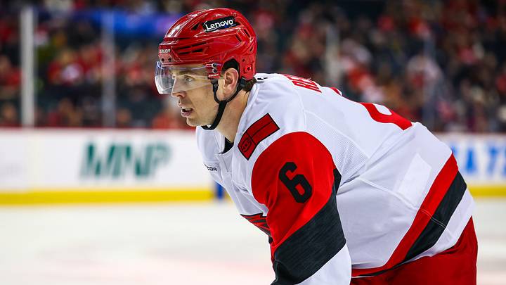 Mar 7, 2026; Calgary, Alberta, CAN; Carolina Hurricanes defenseman Mike Reilly (6) against the Calgary Flames during the third period at Scotiabank Saddledome. Mandatory Credit: Sergei Belski-Imagn Images