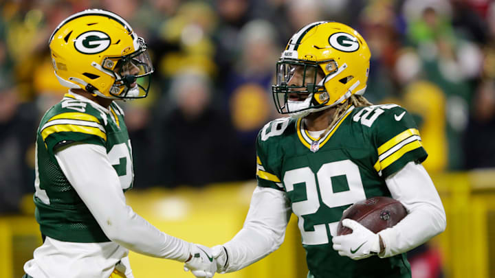 Green Bay Packers safety Xavier McKinney (29) celebrates intercepting a pass against San Francisco 49ers quarterback Brandon Allen with cornerback Carrington Valentine (24) during their football game Sunday, November 24, 2024, at Lambeau Field in Green Bay, Wisconsin.