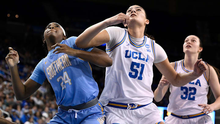 Mar 21, 2025; Los Angeles, California, USA; Southern Lady Jaguars forward DeMya Porter (24) and UCLA Bruins center Lauren Betts (51) jockey for rebounding position during the third quarter of an NCAA Tournament first-round game at Pauley Pavilion presented by Wescom. Mandatory Credit: Robert Hanashiro-Imagn Images