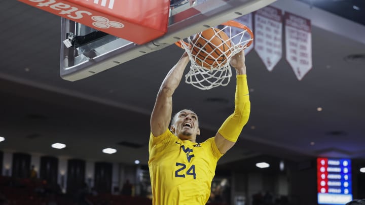 Jan 17, 2024; Norman, Oklahoma, USA; West Virginia Mountaineers forward Patrick Suemnick (24) dunks against the Oklahoma Sooners during the first half at Lloyd Noble Center. Mandatory Credit: Alonzo Adams-USA TODAY Sports Jan 17, 2024; Norman, Oklahoma, USA; West Virginia Mountaineers forward Patrick Suemnick (24) dunks against the Oklahoma Sooners during the first half at Lloyd Noble Center. Mandatory Credit: Alonzo Adams-USA TODAY Sports