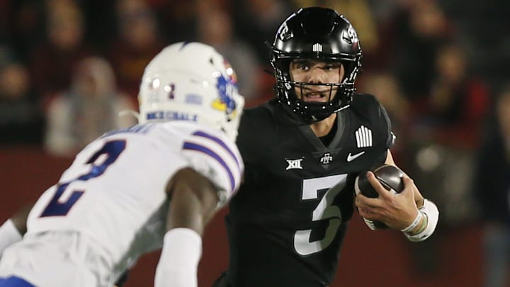 Iowa State Cyclones' quarterback Rocco Becht (3) runs with the ball around Kansas Jayhawks wide receiver Lawrence Arnold (2) during the first quarter at Jack Trice Stadium on Saturday, Nov. 4, 2023, in Ames, Iowa.
