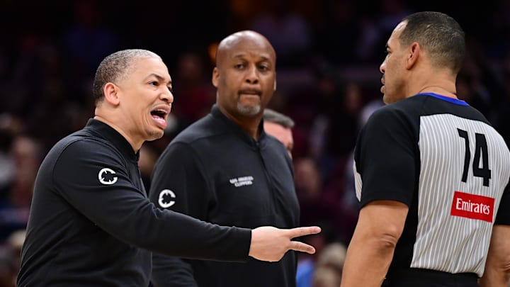 Mar 30, 2025; Cleveland, Ohio, USA; Los Angeles Clippers head coach Tyronn Lue argues with referee Curtis Blair (74) during the second half against the Cleveland Cavaliers at Rocket Arena. Mandatory Credit: Ken Blaze-Imagn Images