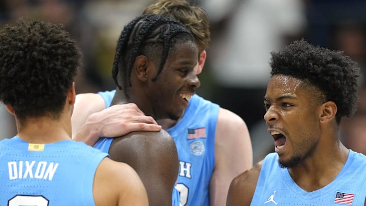 Jan 17, 2026; Berkeley, California, USA; North Carolina Tar Heels guard Jaydon Young (4) celebrates with guard Derek Dixon (3) during the second half against the California Golden Bears at Haas Pavilion. Mandatory Credit: Darren Yamashita-Imagn Images
