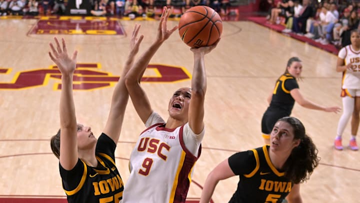Jan 29, 2026; Los Angeles, California, USA; USC Trojans guard Jazzy Davidson (9) shoots a basket as she is defended by Iowa Hawkeyes guard Teagan Mallegni (55) and guard Ava Heiden (5) in the first half at Galen Center. Mandatory Credit: Jayne Kamin-Oncea-Imagn Images