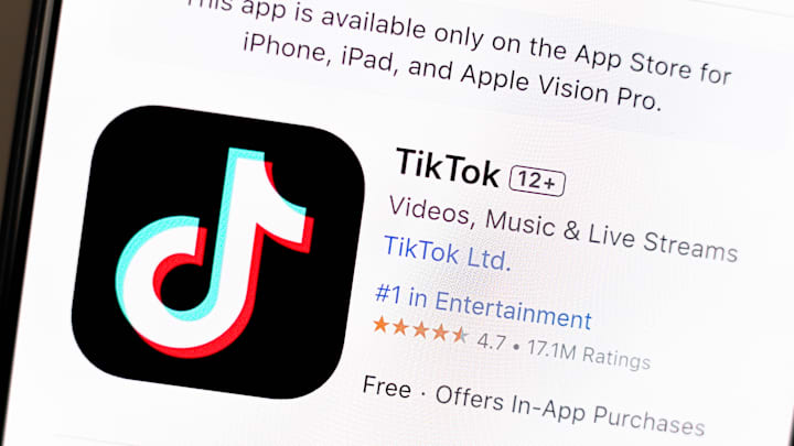 In this photo illustration, the TikTok app is seen on the...