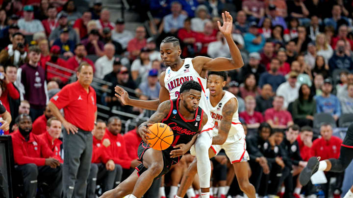 Mar 24, 2022; San Antonio, TX, USA; Houston Cougars guard Jamal Shead (1) drives to the basket against Arizona Wildcats guard Dalen Terry (4) during the second half in the semifinals of the South regional of the men's college basketball NCAA Tournament at AT&T Center. Mandatory Credit: Daniel Dunn-Imagn Images