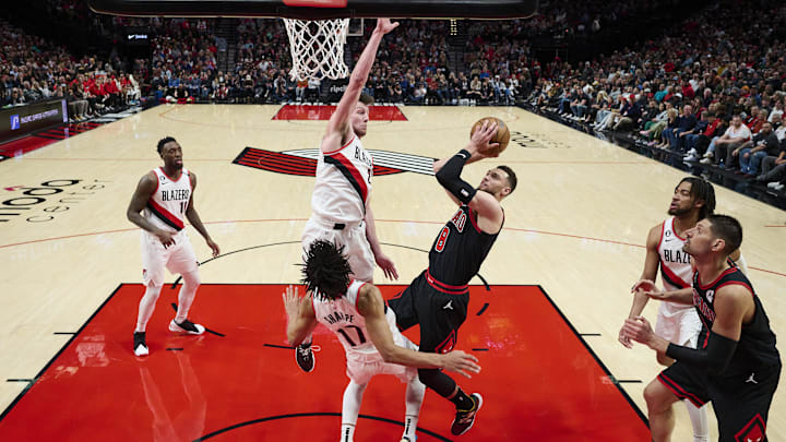 Chicago Bulls guard Zach LaVine (8) shoots a basket during the first half against Portland Trail Blazers guard Shaedon Sharpe (17) and forward Drew Eubanks (24) at Moda Center. Mandatory Credit: Troy Wayrynen-Imagn Images Chicago Bulls guard Zach LaVine (8) shoots a basket during the first half against Portland Trail Blazers guard Shaedon Sharpe (17) and forward Drew Eubanks (24) at Moda Center. Mandatory Credit: Troy Wayrynen-Imagn Images