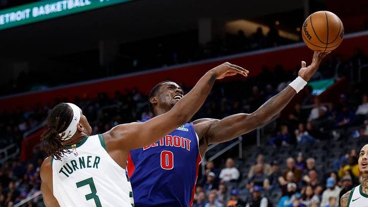 Dec 6, 2025; Detroit, Michigan, USA;  Detroit Pistons center Jalen Duren (0) shoots on Milwaukee Bucks center Myles Turner (3) in the second half at Little Caesars Arena. Mandatory Credit: Rick Osentoski-Imagn Images