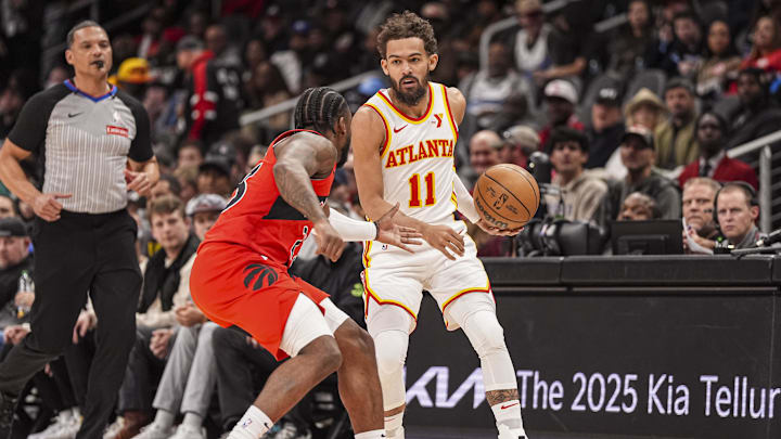 Jan 25, 2025; Atlanta, Georgia, USA; Atlanta Hawks guard Trae Young (11) dribbles against Toronto Raptors guard Jamal Shead (23) during the first half at State Farm Arena. Mandatory Credit: Dale Zanine-Imagn Images Jan 25, 2025; Atlanta, Georgia, USA; Atlanta Hawks guard Trae Young (11) dribbles against Toronto Raptors guard Jamal Shead (23) during the first half at State Farm Arena. Mandatory Credit: Dale Zanine-Imagn Images