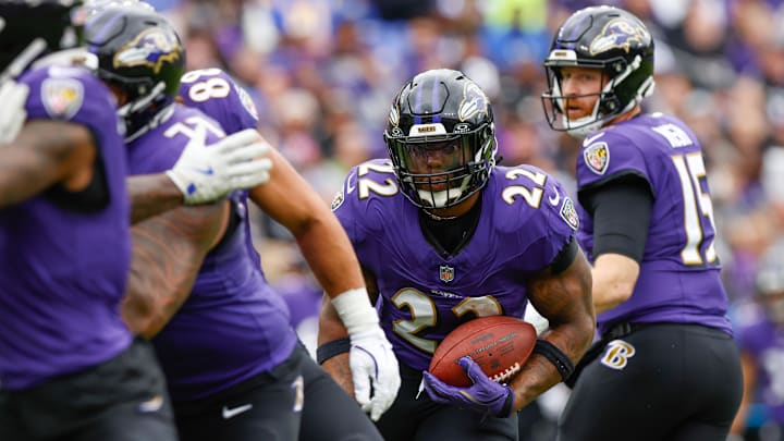 Oct 12, 2025; Baltimore, Maryland, USA; Baltimore Ravens running back Derrick Henry (22) carries the ball against the Los Angeles Rams during the first quarter of the game at M&T Bank Stadium. Mandatory Credit: Peter Casey-Imagn Images