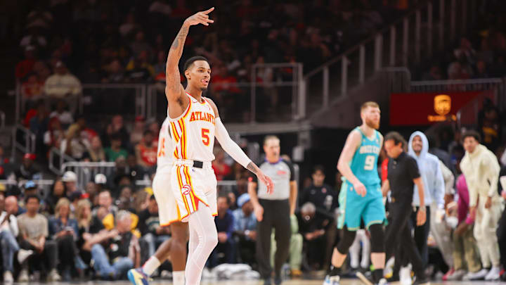 Mar 23, 2024; Atlanta, Georgia, USA; Atlanta Hawks guard Dejounte Murray (5) reacts against the
