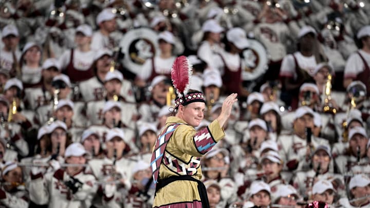 Sep 3, 2023; Orlando, Florida, USA; Florida State Seminoles head drum major John Justice directs the Marching Chiefs during the game against the Louisiana State Tigers at Camping World Stadium. Mandatory Credit: Melina Myers-USA TODAY Sports