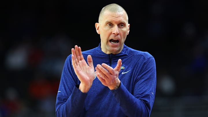 Mark Pope cheers on his team as they face Duquesne in the NCAA Tournament