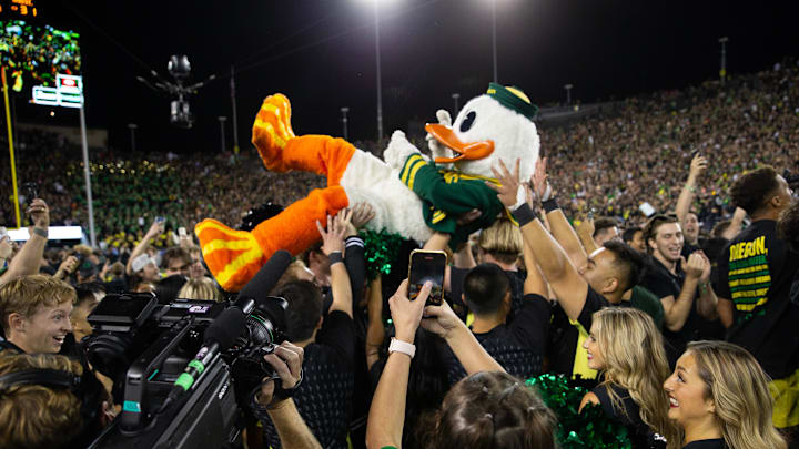 The Oregon Ducks surfs the crowd after the football team defeated Ohio State at Autzen Stadium Saturday, Oct. 12, 2024.