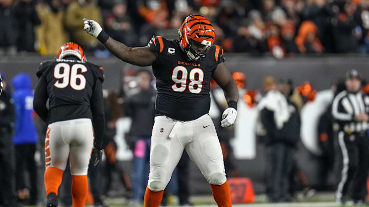 Jan 15, 2023; Cincinnati, Ohio, USA; Cincinnati Bengals defensive tackle DJ Reader (98) celebrates after deflecting a pass in the fourth quarter during an NFL wild-card playoff football game between the Baltimore Ravens and the Cincinnati Bengals, Sunday, Jan. 15, 2023, at Paycor Stadium in Cincinnati at Paycor Stadium. Mandatory Credit: Sam Greene-Imagn Images