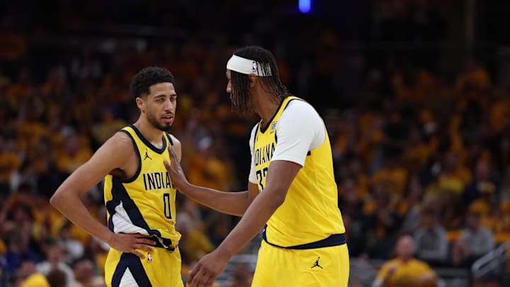 May 25, 2025; Indianapolis, Indiana, USA; Indiana Pacers guard Tyrese Haliburton (0) and center Myles Turner (33) talk during the third quarter of game three of the eastern conference finals for the 2025 NBA Playoffs at Gainbridge Fieldhouse. Mandatory Credit: Trevor Ruszkowski-Imagn Images May 25, 2025; Indianapolis, Indiana, USA; Indiana Pacers guard Tyrese Haliburton (0) and center Myles Turner (33) talk during the third quarter of game three of the eastern conference finals for the 2025 NBA Playoffs at Gainbridge Fieldhouse. Mandatory Credit: Trevor Ruszkowski-Imagn Images