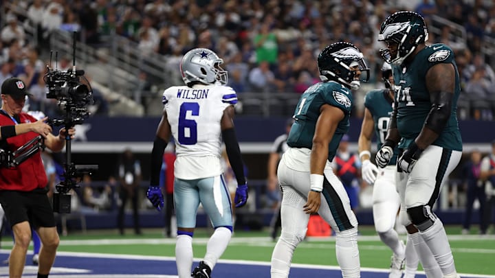 Nov 10, 2024; Arlington, Texas, USA; Philadelphia Eagles quarterback Jalen Hurts (1) and offensive tackle Fred Johnson (74) celebrate a touchdown against the Dallas Cowboys in the third quarter at AT&T Stadium. Mandatory Credit: Tim Heitman-Imagn Images