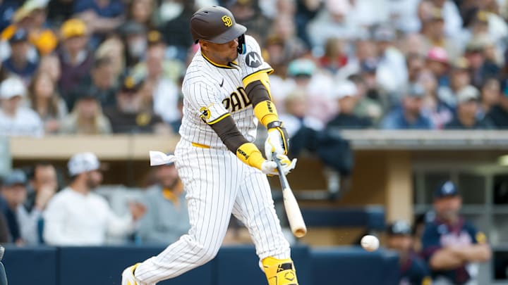 Mar 29, 2025; San Diego, California, USA; San Diego Padres designated hitter Yuli Gurriel (10) hits an RBI single during the seventh inning against the Atlanta Braves at Petco Park. Mandatory Credit: David Frerker-Imagn Images Mar 29, 2025; San Diego, California, USA; San Diego Padres designated hitter Yuli Gurriel (10) hits an RBI single during the seventh inning against the Atlanta Braves at Petco Park. Mandatory Credit: David Frerker-Imagn Images