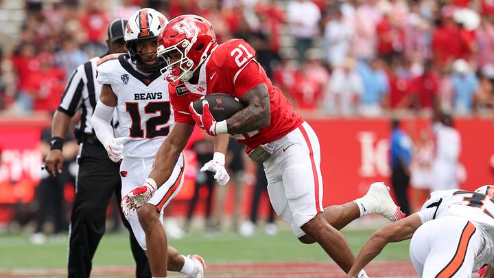 Sep 5, 2026; Houston, Texas, USA; Houston Cougars running back Makhi Hughes (21) runs with the ball during the first quarter against the Oregon State Beavers at TDECU Stadium. Mandatory Credit: Troy Taormina-Imagn Images