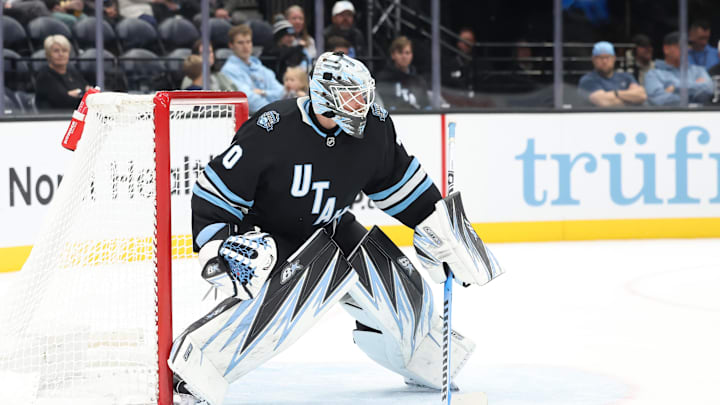 Oct 24, 2024; Salt Lake City, Utah, USA; Utah Hockey Club goaltender Karel Vejmelka (70) clears the puck against the Colorado Avalanche during the third period at Delta Center. Mandatory Credit: Rob Gray-Imagn Images