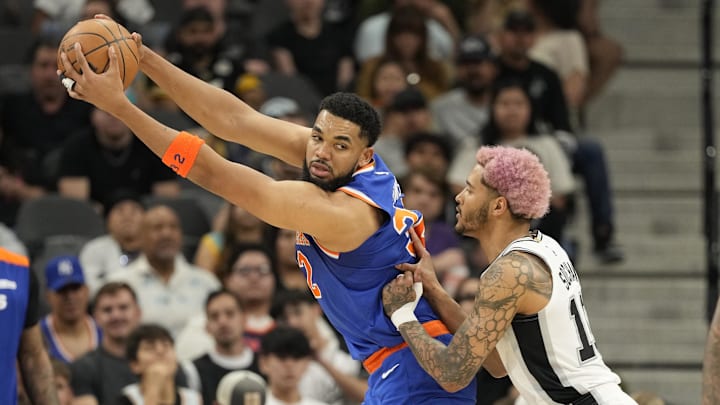 Mar 19, 2025; San Antonio, Texas, USA; New York Knicks forward Karl-Anthony Towns (32) posts up on San Antonio Spurs forward Jeremy Sochan (10) during the first half at Frost Bank Center. Mandatory Credit: Scott Wachter-Imagn Images