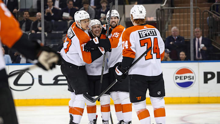 Apr 11, 2024; New York, New York, USA; Philadelphia Flyers right wing Bobby Brink (10) celebrates his goal against the New York Rangers with defenseman Erik Johnson (77), center Ryan Poehling (25) and right wing Owen Tippett (74) during the second period at Madison Square Garden. Mandatory Credit: Danny Wild-Imagn Images