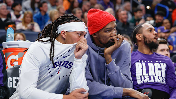 Feb 5, 2025; Oklahoma City, Oklahoma, USA; Phoenix Suns guard Damion Lee (10) and Phoenix Suns forward Kevin Durant (35) watch their team play against the Oklahoma City Thunder during the second half of a game at Paycom Center. Mandatory Credit: Alonzo Adams-Imagn Images