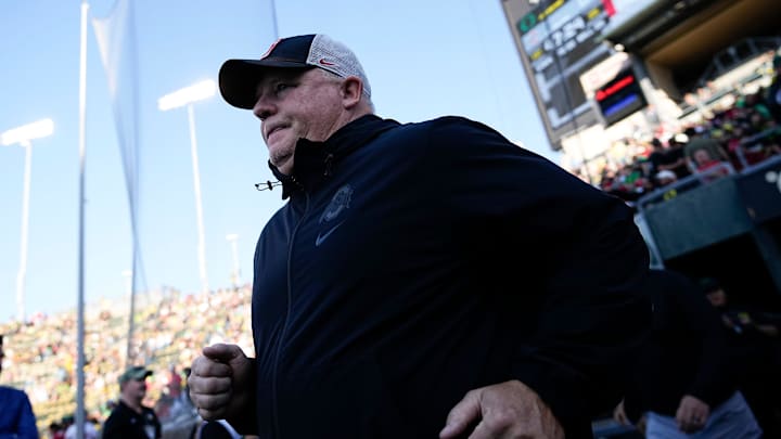 Ohio State Buckeyes offensive coordinator Chip Kelly takes the field prior to the NCAA football game between the Ohio State Buckeyes and the Oregon Ducks at Autzen Stadium.