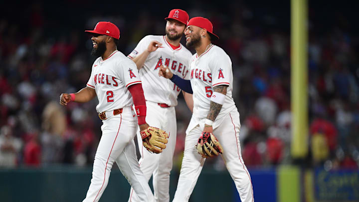 May 10, 2025; Anaheim, California, USA; Los Angeles Angels second baseman Luis Rengifo (2) first baseman Nolan Schanuel (18) and third baseman Yoán Moncada (5) celebrate the victory against the Baltimore Orioles at Angel Stadium. Mandatory Credit: Gary A. Vasquez-Imagn Images