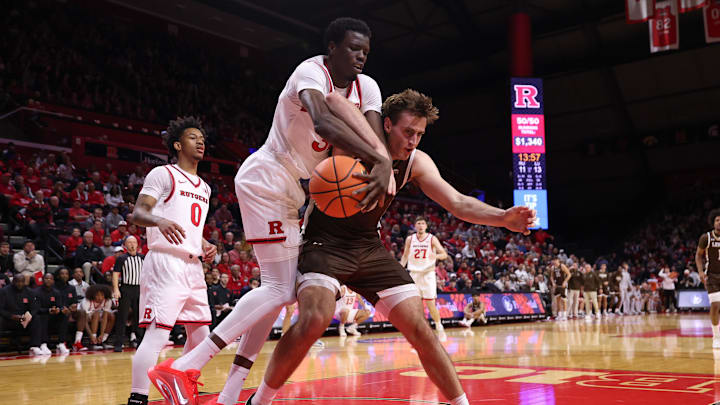 Nov 14, 2025; Piscataway, New Jersey, USA; Lehigh Mountain Hawks forward Hank Alvey (35) goes to the basket as Rutgers Scarlet Knights center Baye Fall (32) defends during the first half at Jersey Mike's Arena. Mandatory Credit: Vincent Carchietta-Imagn Images