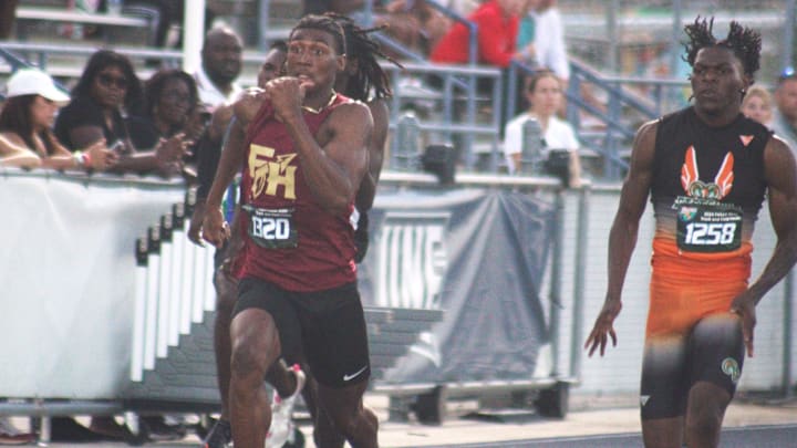 Micahi Danzy (1320) of Florida High and Kennith Martin (1258) of Gainesville Eastside race side-by-side in the boys 200-meter dash during the FHSAA Class 2A high school track and field meet in Jacksonville on May 16, 2024. [Clayton Freeman/Florida Times-Union]