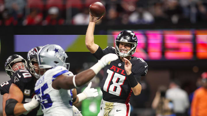 Nov 3, 2024; Atlanta, Georgia, USA; Atlanta Falcons quarterback Kirk Cousins (18) throws a pass against the Dallas Cowboys in the first quarter at Mercedes-Benz Stadium.