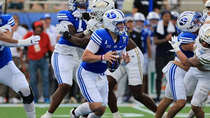 Dec 27, 2025; Orlando, FL, USA; BYU Cougars quarterback Bear Bachmeier (47) runs with the ball against the Georgia Tech Yellow Jackets during the first quarter at Camping World Stadium. Mandatory Credit: Kim Klement Neitzel-Imagn Images