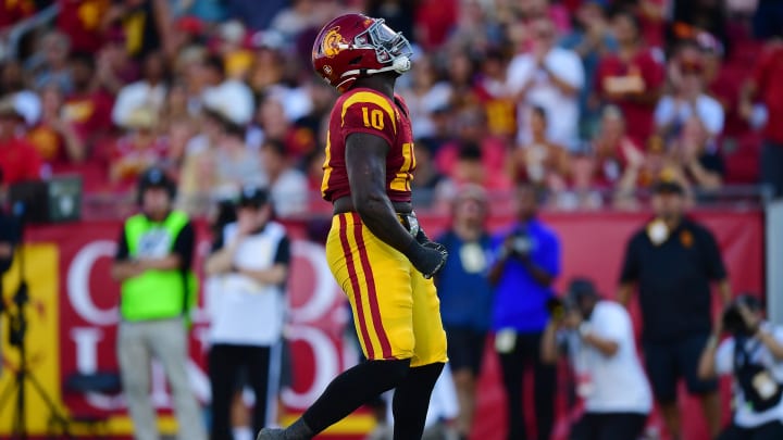 Aug 26, 2023; Los Angeles, California, USA; Southern California Trojans defensive end Jamil Muhammad (10) reacts after sacking San Jose State Spartans quarterback Chevan Cordeiro (2) during the first half at Los Angeles Memorial Coliseum. Mandatory Credit: Gary A. Vasquez-USA TODAY Sports Aug 26, 2023; Los Angeles, California, USA; Southern California Trojans defensive end Jamil Muhammad (10) reacts after sacking San Jose State Spartans quarterback Chevan Cordeiro (2) during the first half at Los Angeles Memorial Coliseum. Mandatory Credit: Gary A. Vasquez-USA TODAY Sports