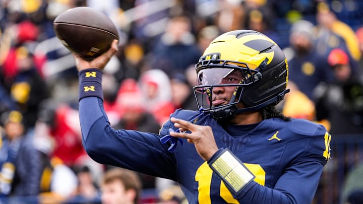Michigan quarterback Bryce Underwood (19) warms up at Michigan Stadium in Ann Arbor on Saturday, Nov. 29, 2025.