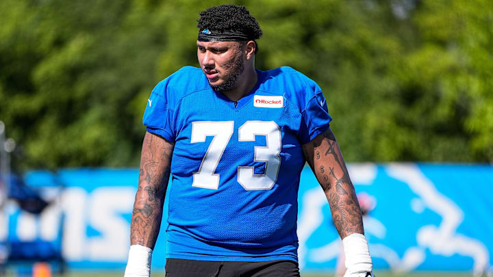 Detroit Lions guard Christian Mahogany (73) walks of the field after practice during training camp at Meijer Performance Center in Allen Park on Tuesday, July 22, 2025. Detroit Lions guard Christian Mahogany (73) walks of the field after practice during training camp at Meijer Performance Center in Allen Park on Tuesday, July 22, 2025.