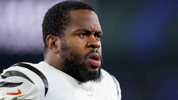 Cincinnati Bengals defensive tackle BJ Hill (92) stretches during warmups before the first quarter of the NFL Week 11 game between the Baltimore Ravens and the Cincinnati Bengals at M&T Bank Stadium in Baltimore on Thursday, Nov. 16, 2023.
