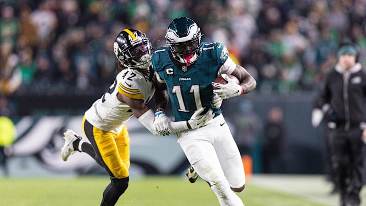 Dec 15, 2024; Philadelphia, Pennsylvania, USA; Philadelphia Eagles wide receiver A.J. Brown (11) runs with the ball against Pittsburgh Steelers cornerback James Pierre (42) at Lincoln Financial Field. Mandatory Credit: Bill Streicher-Imagn Images