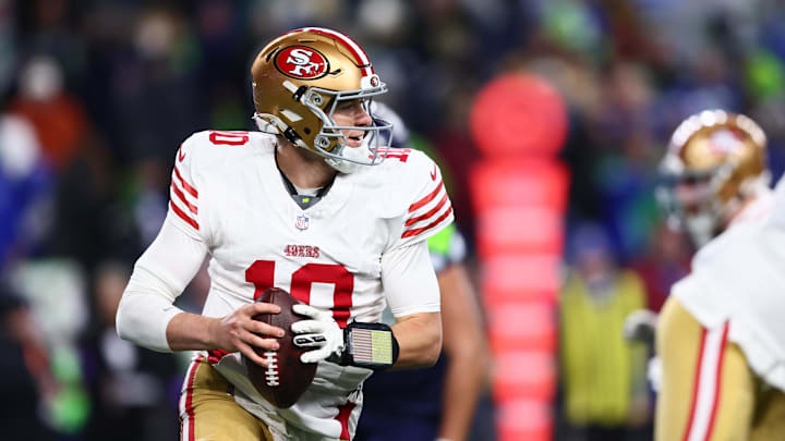 Jan 17, 2026; Seattle, WA, USA; San Francisco 49ers quarterback Mac Jones (10) rolls out against the Seattle Seahawks during the second half in an NFC Divisional Round game at Lumen Field. Mandatory Credit: Kevin Ng-Imagn Images
