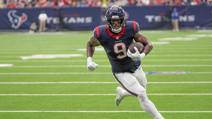 Dec 31, 2023; Houston, Texas, USA; Houston Texans tight end Brevin Jordan (9) scores a touchdown after the catch against the Tennessee Titans in the second quarter at NRG Stadium. Mandatory Credit: Thomas Shea-Imagn Images