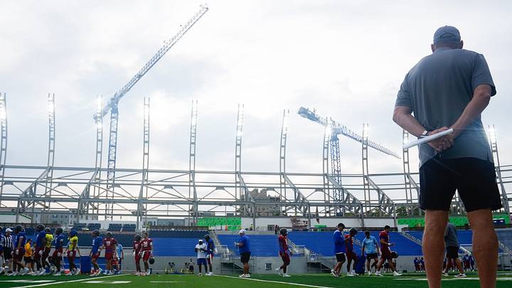 Kansas coach Lance Leipold watches his players as construction continues on the east stands at David Booth Kansas Memorial Stadium on Aug. 14, 2026. Kansas coach Lance Leipold watches his players as construction continues on the east stands at David Booth Kansas Memorial Stadium on Aug. 14, 2026.