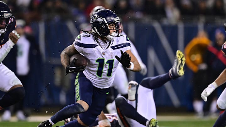 Dec 26, 2024; Chicago, Illinois, USA; Seattle Seahawks wide receiver Jaxon Smith-Njigba (11) runs after a catch against the Chicago Bears during the third quarter at Soldier Field. Mandatory Credit: Daniel Bartel-Imagn Images