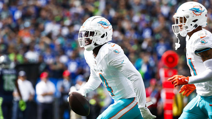 Miami Dolphins cornerback Kader Kohou (4) celebrates following an interception against the Seattle Seahawks during the first quarter at Lumen Field in Week 3 of the 2024 season.