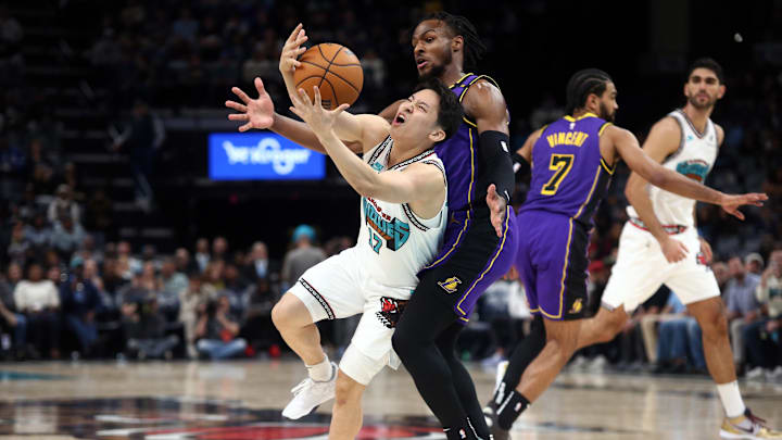 Memphis Grizzlies guard Yuki Kawamura (17) looses control of the ball as as he is fouled by Los Angeles Lakers guard Bronny James (9) during the second half at FedExForum. 