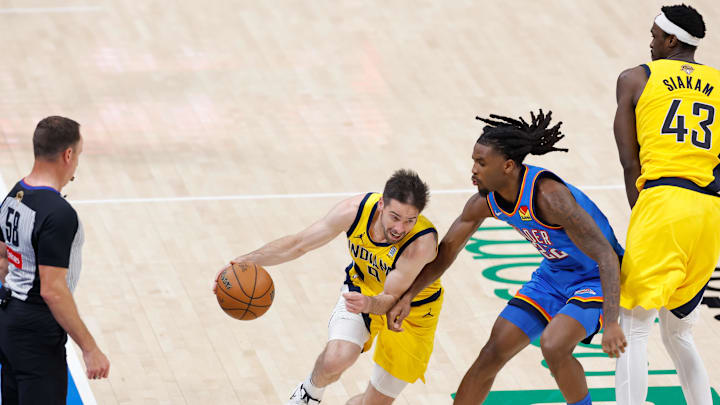 Jun 22, 2025; Oklahoma City, Oklahoma, USA; Indiana Pacers guard T.J. McConnell (9) dribbles the ball as Oklahoma City Thunder guard Cason Wallace (22) defends during the second half of game seven of the 2025 NBA Finals at Paycom Center. Mandatory Credit: Alonzo Adams-Imagn Images