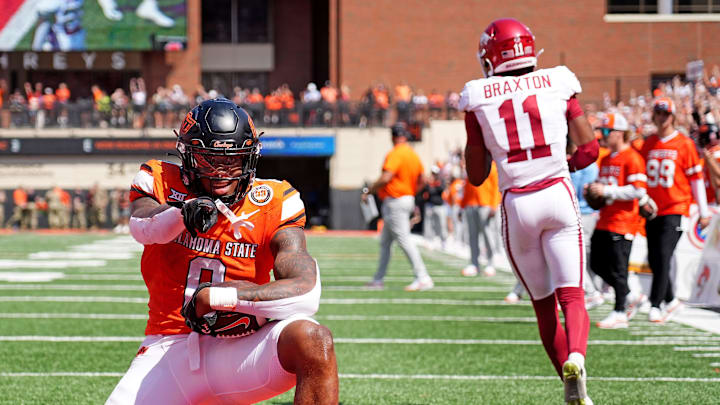 Oklahoma State's Ollie Gordon II (0) celebrates a 2-point conversion front of /tJaylon Braxton (11) in double overtime of the college football game between the Oklahoma State Cowboys and the Arkansas Razorbacks at Boone Pickens Stadium in Stillwater, Okla.,, Saturday, Sept., 7, 2024.