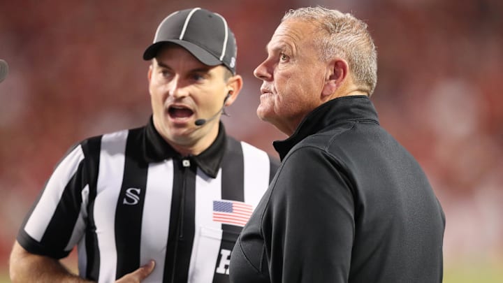 Arkansas Razorbacks head coach Sam Pittman talks to an official after a call in the second quarter against the LSU Tigers at Donald W. Reynolds Razorback Stadium.