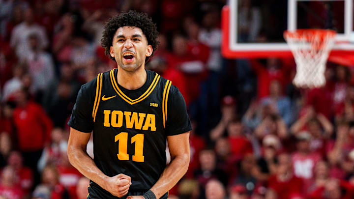 Mar 8, 2026; Lincoln, Nebraska, USA; Iowa Hawkeyes guard Kael Combs (11) reacts after a three-point shot to force overtime against the Nebraska Cornhuskers during the second half at Pinnacle Bank Arena. Mandatory Credit: Dylan Widger-Imagn Images